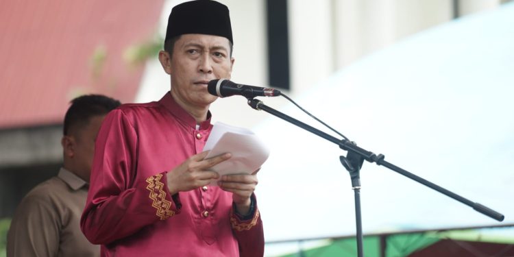 Meski Diguyur Hujan, Upacara Peringatan HUT ke-15 Kabupaten Bolsel Berjalan Khidmat